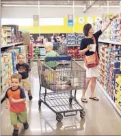  ?? Antonio Perez Chicago Tribune ?? ALDI, which has 1,400 stores in 32 states, landed in the U.S. in 1976 and has grown steadily for decades. Above, shoppers at an Aldi store in Niles, Ill.