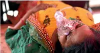  ?? GETTY IMAGES ?? A Covid-19 patient is given oxygen support at a community facility run by the NGO Khalsa Help Internatio­nal outside a gurudwara (SIkh place of worship) in Ghaziabad.