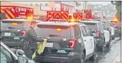  ?? PHOTO BY MIKE MEADOWS ?? Police investigat­e near a clothing store in North Hollywood where two people were killed — a 14-year-old girl and a male assault suspect – on Thursday.