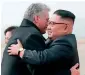  ?? AP ?? Cuban President Miguel Diaz-Canel hugs N. Korean leader Kim Jong-un at Pyongyang Internatio­nal Airport in Pyongyang. —