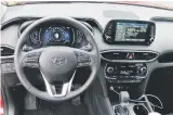  ??  ?? The interior of the 2019 Hyundai Santa Fe adopts a layered instrument panel with a large primary gauge cluster and floating infotainme­nt touchscree­n at the top of the centre stack.