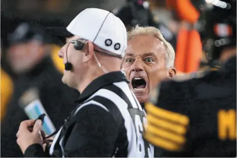  ?? CP FILE PHOTO ?? Hamilton Tiger-Cats special teams co-ordinator Jeff Reinebold yells at a referee following an attempted on-side kick by the Tiger-Cats during a game against the Edmonton Eskimos in Hamilton on Oct. 28, 2016. Reinebold will be joining the B.C. Lions as...