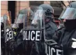  ?? JOSE LUIS MAGANA, AP ?? Riot police push back demonstrat­ors in Washington, D.C., during the inaugurati­on of President Trump.