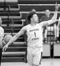  ?? STEPHEN M. DOWELL/ORLANDO SENTINEL ?? Montverde Academy guard Cade Cunningham signals to a teammate in between plays Friday night during his team’s home basketball game against Lakewood.