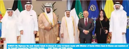  ??  ?? KUWAIT: His Highness the Amir Sheikh Sabah Al-Ahmad Al-Jaber Al-Sabah meets with Minister of Social Affairs Saad Al-Kharaz and members of the Kuwaiti humanitari­an Friendship Society. — Amiri Diwan and KUNA photos