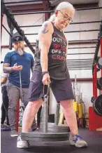  ?? ?? Vicky Schofield, 70, lifts weights in the Dinnie stones event as she prepares for the Lift for Lani strongman competitio­n, named for her late granddaugh­ter, who was addicted to alcohol.