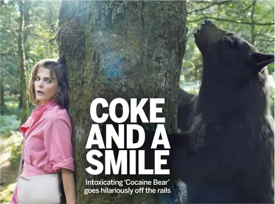  ?? UNIVERSAL PICTURES ?? Concerned mom Sari (Keri Russell) goes into the woods looking for her daughter and instead encounters the jacked-up beast of “Cocaine Bear.”