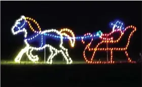  ?? BY MICHELLE N. LYNCH—MEDIANEWS GROUP ?? Lights form a one-horse open sleigh with driver at Gring’s Mill Recreation Area.