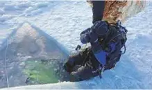  ??  ?? ■ Fardous had to break a few feet of solid ice to get to the ocean — the only entry and exit point for divers.