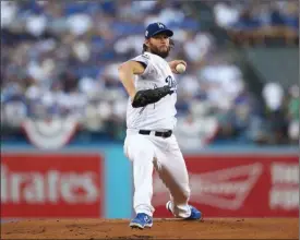  ?? The Associated Press ?? Los Angeles Dodgers starting pitcher Clayton Kershaw throws during Game 1 of the World Series against the Houston Astros on Tuesday in Los Angeles.