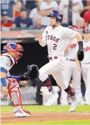  ?? TONY DEJAK/ASSOCIATED PRESS ?? Albuquerqu­e’s Alex Bregman (2) races home in the second inning to score for the American League. Catcher Willson Contreras of the NL awaits the throw.