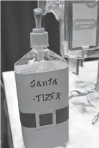  ?? ?? A new spin name on sanitizer sits on a counter on Nov. 15 at The Santa Experience.