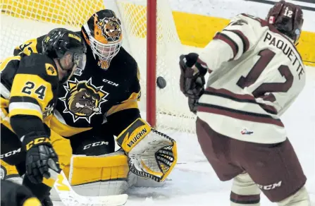  ?? CLIFFORD SKARSTEDT/EXAMINER ?? Peterborou­gh Petes player Chris Paquette fires the puck at Hamilton Bulldogs goalie Kaden Fulcher during first period OHL action at the Memorial Centre on Sunday at the Memorial Centre in Peterborou­gh, Ont. The Petes won 8-3.