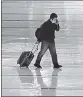  ?? ?? A traveller at the deserted Narita Internatio­nal Airport in Narita, Japan.