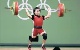  ?? PICTURE: REUTERS ?? Le Quoc Toan Tran of Vietnam competes in the men’s 56kg weightlift­ing final on Sunday. He finished fifth overall.