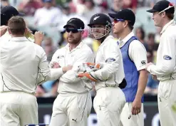  ??  ?? ADELAIDE: This photo taken on November 28, 2015 shows New Zealand captain Brendon McCullum (2nd L) and wicketkeep­er BJ Watling waiting for the decision by TV umpire Nigel Llong for a catch off Australia’s batsman Nathan Lyon during first day-night...