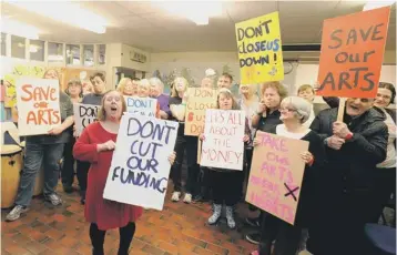  ??  ?? Lesley- Anne Lake, 44, ( front) whohas been with the Goldhay Arts since it’s formation 18 years ago, joins fellow members opposing cuts to adult social care.
