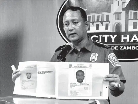  ?? BONG GARCIA ?? ZAMBOANGA – Senior Superinten­dent Angelito Casimiro, ZCPO director, presents to the media Monday the computer-generated sketches of the July 23 bombing suspects who killed one person and injured 10 others in Zamboanga City.