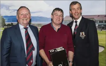  ??  ?? DessieWard, winner of the Dundalk Singles 18 Hole Open Stableford last Monday, receives his prize from Eamonn Traynor (left) from sponsors The Bayview Lounge & Bar and Captain Mickey Coburn.
