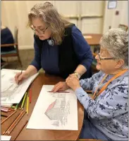  ?? MIKE URBAN - MEDIANEWS GROUP ?? Artist Julie Longacre, left, gives coloring instructio­n to Alexandra “Sandra” Pfenig, a resident of Chestnut Knoll Personal Care and Memory Care in Boyertown, during a class at the facility on Saturday.