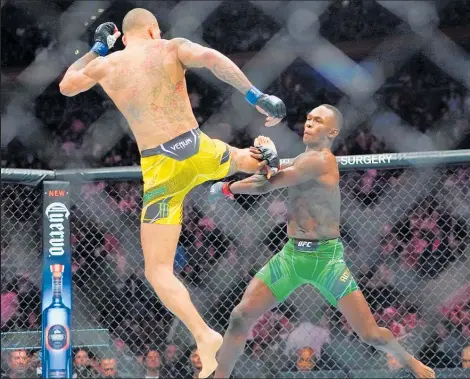  ?? Photo / AP ?? Brazil’s Alex Pereira lands a kick in his UFC 281 title fight against New Zealand’s Israel Adesanya.