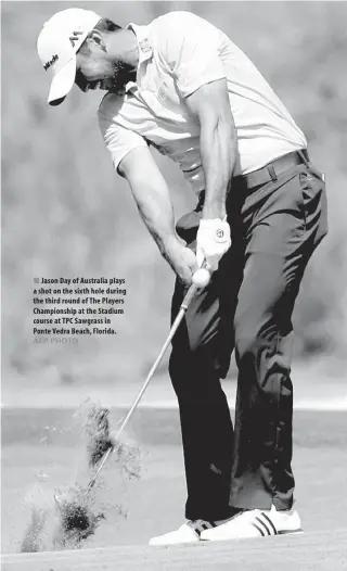  ??  ?? Jason Day of Australia plays a shot on the sixth hole during the third round of The Players Championsh­ip at the Stadium course at TPC Sawgrass in Ponte Vedra Beach, Florida.