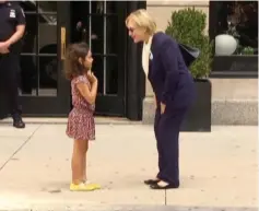  ?? (Reuters) ?? US DEMOCRATIC presidenti­al nominee Hillary Clinton greets a young girl after leaving her daughter’s home in Manhattan on Friday.