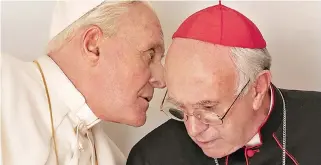  ??  ?? ANTHONY HOPKINS (L) plays Pope Benedict while Jonathan Pryce (R) plays Pope Francis in Netflix’ The Two Popes.