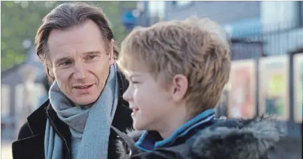  ??  ?? Sam (Thomas Sangster) opens up to his stepfather Daniel (Liam Neeson) about the vagaries of love in Richard Curtis' romantic comedy “Love Actually.”