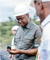  ?? ?? ▲ Inyatsi Group Holdings Investment Cluster CEO Paul Lwiindi inspecting some of the anthracite coal mined at Maloma Clliery Mine during a recent tour of the facility.
