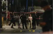  ?? (AP/Maya Alleruzzo) ?? Israeli police inspect the site of a shooting attack on Saturday in Tel Aviv, Israel.