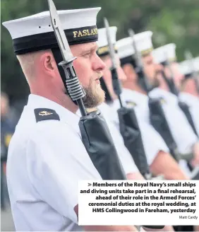  ?? Matt Cardy ?? > Members of the Royal Navy’s small ships and diving units take part in a final rehearsal, ahead of their role in the Armed Forces’ ceremonial duties at the royal wedding, at HMS Collingwoo­d in Fareham, yesterday