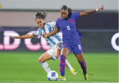  ?? RYAN SUN/THE ASSOCIATED PRESS ?? United States forward Jaedyn Shaw, right, and Argentina defender Eliana Stábile vie for the ball Friday in the CONCACAF Women’s Gold Cup in Carson, Calif. Shaw had two goals in the 4-0 win.