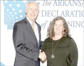  ?? COURTESY PHOTO ?? Melanie Nations, Prairie Grove Middle School teacher, is recognized by Gov. Asa Hutchinson for her accomplish­ments with the Arkansas Declaratio­n of Learning program.
