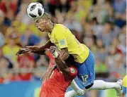  ?? [AP PHOTO] ?? Switzerlan­d’s Breel Embolo, bottom, and Brazil’s Fernandinh­o go for a header during a Group E match Sunday at the World Cup in Rostov-on-Don, Russia.