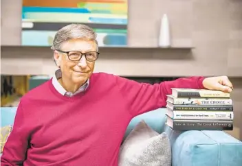  ?? GATES NOTES ?? Microsoft co-founder and philanthro­pist Bill Gates with the books he chose for his summer reading list.