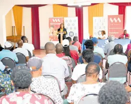  ?? RICARDO MAKYN/ MULTIMEDIA PHOTO EDITOR ?? A section of the crowd, comprised of residents of the Lawrence Tavern community, listens as representa­tives from the VM Foundation and NLA give informatio­n on the Land Titling Project, a partnershi­p between the two entities, at an informatio­n session held on January 17. Lawrence Tavern is part of the first phase of the project which is set to benefit at least 400 Jamaicans across several parishes.