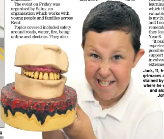  ?? FM4812901 FM4812917 ?? Hamza, 11, from South Borough School, has fun finding out about road safety Jack, 11, from Senacre Wood, grimaces at a model of dentures stained by nicotine, at a stall where he was shown what drugs and alcohol can do Pictures: John Westhrop