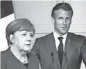  ?? KAY NIETFELD/DPA VIA AP ?? Germany’s Angela Merkel and France’s Emmanuel Macron announced a deal to create a $543 billion EU recovery fund.