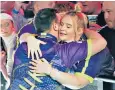  ?? ?? Luke Littler embraces girlfriend Eloise Milburn after the darts semi-final