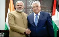  ?? -Reuters ?? MAIDEN PALESTINE TRIP: Palestinia­n President Mahmoud Abbas with India’s Prime Minister Narendra Modi in Ramallah, in the occupied West Bank on Saturday.