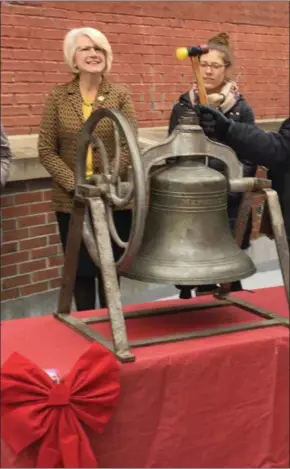  ?? MICHAEL GWIZDALA MGWIZDALA@DIGITALFIR­STMEDIA.COM ?? Michael Barrett, executive director of the Hudson Mohawk Industrial Gateway rings a bell Wednesday during a ceremony to mark the opening of the holiday shopping season in downtown Troy.