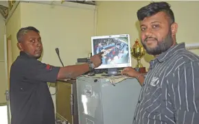  ?? Photo: Mereleki Nai ?? SOFTEC Fiji manager Shakeel Khan and informatio­n technology (IT) officer from the Nadi Town Council Roneel Raj showing a video image of the market from one of the CCTV cameras installed.