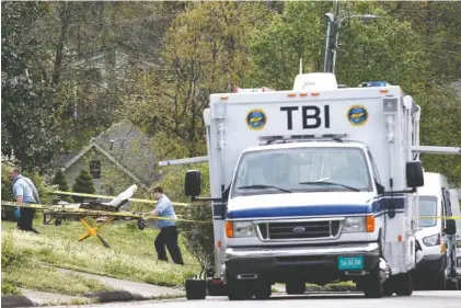  ?? STAFF PHOTO BY C.B. SCHMELTER ?? A stretcher is brought to a house in the 9100 block of Broyles Drive on Tuesday where a Hamilton County sheriff’s deputy shot and killed Charles Bradley Payne.