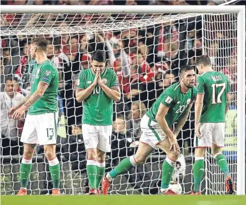  ??  ?? ALL OVER: Republic of Ireland’s Jeff Henrick, Robbie Brady, Shane Duffy and Stephen Ward after Christian Eriksen’s third goal for Denmark