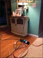  ?? The Associated Press ?? BLACKOUT: This Oct. 6 photo provided by Kyla Awalt shows electrical cords winding around on the floor in a family house to provide electricit­y from a generator outside during Pacific Gas and Electric’s shutoff in Paradise, Calif.