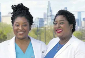  ?? (Photo: AP) ?? Dr Brittani James (left) and her twin sister Dr Brandi Jackson stand for a portrait in the Bronzevill­e neighbourh­ood of Chicago, Sunday, May 2, 2021. The identical twin doctors, who have fought bigotry all their lives, have a lofty new mission — dismantlin­g racism in medicine.