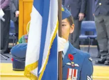  ??  ?? A member of the colour party holds the Nova Scotia flag at the Remembranc­e Day Ceremony in Bridgetown Nov. 11.