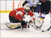  ?? MIKE EHRMANN — GETTY IMAGES ?? Roberto Luongo makes one of his 37saves Thursday night, recording his 454th career win in a 5-2victory over St. Louis.