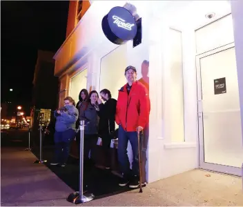  ?? PAUL DALY/THE CANADIAN PRESS ?? Ian Power is first in line at the Tweed store in St. John’s, N.L. on Tuesday, where he made history as the first person to buy legal cannabis for recreation­al use in Canada.